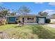 Charming home with a cozy front porch perfect for relaxing and enjoying the neighborhood at 908 Woodley Rd, Clearwater, FL 33764