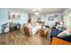 Spacious living room featuring hardwood floors, modern lighting, and comfortable seating at 908 Woodley Rd, Clearwater, FL 33764