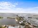 Scenic aerial view featuring a pier with restaurants, a marina, and stunning ocean views at 105 4Th Ne Ave # 405, St Petersburg, FL 33701