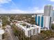 Beautiful aerial showcasing a low-rise condo community nestled among mature trees at 105 4Th Ne Ave # 405, St Petersburg, FL 33701
