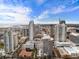 Stunning aerial view of the cityscape, showcasing numerous high-rise buildings and a picturesque waterfront in the distance at 105 4Th Ne Ave # 405, St Petersburg, FL 33701