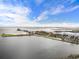 Wide aerial view of waterfront, featuring pier access, beach, park, and marina at 105 4Th Ne Ave # 405, St Petersburg, FL 33701