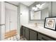 Bathroom vanity and sink, with doorway to hallway at 105 4Th Ne Ave # 405, St Petersburg, FL 33701