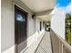 Exterior entrance to unit with a storm door, number, and walkway at 105 4Th Ne Ave # 405, St Petersburg, FL 33701