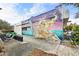 Building exterior featuring a vibrant mural, adding an artistic touch to the property at 105 4Th Ne Ave # 405, St Petersburg, FL 33701