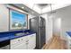 Bright kitchen features blue countertops, stainless steel refrigerator, and hardwood floors at 105 4Th Ne Ave # 405, St Petersburg, FL 33701