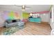 Living room with hardwood floors and open view to kitchen area at 105 4Th Ne Ave # 405, St Petersburg, FL 33701