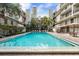 Outdoor community pool with poolside seating, landscaping and views of the complex at 105 4Th Ne Ave # 405, St Petersburg, FL 33701