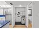 Handy utility closet featuring water heater and shelving near the kitchen and bathroom at 105 4Th Ne Ave # 405, St Petersburg, FL 33701