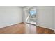 Bedroom with wood floors and sliding glass doors to balcony at 11201 122Nd Ave # 132, Largo, FL 33778