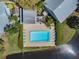 Top-down aerial view of a community pool surrounded by a lake at 11201 122Nd Ave # 132, Largo, FL 33778