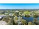 Expansive aerial view of a lakeside neighborhood featuring a nearby park with tennis and baseball fields at 1131 60Th Ave S, St Petersburg, FL 33705