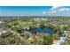 Overhead aerial view of a neighborhood home with a private lake in the background at 1131 60Th Ave S, St Petersburg, FL 33705