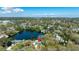 Panoramic aerial view of a lakeside home with city skyline in the distance at 1131 60Th Ave S, St Petersburg, FL 33705