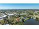 Wonderful aerial view of a neighborhood home with a private lake in the background at 1131 60Th Ave S, St Petersburg, FL 33705