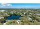 Panoramic aerial view of a lakeside home with city skyline in the distance at 1131 60Th Ave S, St Petersburg, FL 33705