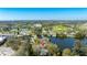 Expansive aerial view of a lakeside neighborhood featuring a nearby park with tennis and baseball fields at 1131 60Th Ave S, St Petersburg, FL 33705