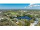 Lovely aerial view of a property by a lake, surrounded by a lively neighborhood at 1131 60Th Ave S, St Petersburg, FL 33705