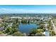 Magnificent view of a home by a lake and other homes in a lively Gathering-friendly neighborhood at 1131 60Th Ave S, St Petersburg, FL 33705