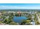 Wide overhead aerial view of a home on a lake in a Gathering-friendly neighborhood at 1131 60Th Ave S, St Petersburg, FL 33705