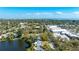 Scenic aerial view of a lakeside home nestled near commercial areas and lush green landscapes at 1131 60Th Ave S, St Petersburg, FL 33705