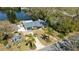 An aerial view of a charming single-Gathering home, showcasing the property's landscaping and lake access at 1131 60Th Ave S, St Petersburg, FL 33705