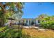 Private fenced backyard with a patio and mature landscaping, ideal for outdoor entertaining at 1131 60Th Ave S, St Petersburg, FL 33705