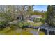 Waterfront property with a fenced yard and mature trees, providing a tranquil and private outdoor space at 1131 60Th Ave S, St Petersburg, FL 33705