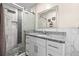 Updated bathroom features a modern vanity with granite countertops and a glass-enclosed shower at 1131 60Th Ave S, St Petersburg, FL 33705