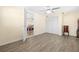 Bedroom with laminate floors, ceiling fan, closet, and an open doorway to another room at 1131 60Th Ave S, St Petersburg, FL 33705