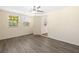 Bedroom featuring neutral walls, laminate flooring, and natural light from two large windows at 1131 60Th Ave S, St Petersburg, FL 33705