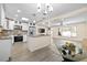A modern open-concept kitchen that is designed to flow seamlessly into the home's dining and living areas at 1131 60Th Ave S, St Petersburg, FL 33705