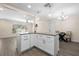Bright kitchen with granite countertops, pendant lighting, and an open layout connecting to the living spaces at 1131 60Th Ave S, St Petersburg, FL 33705