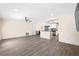 Spacious open-concept living room featuring modern flooring with seamless connection to the kitchen area at 1131 60Th Ave S, St Petersburg, FL 33705
