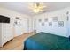 Bedroom featuring a ceiling fan, two closets, and a dark-colored bed at 11335 Mcmullen Loop, Riverview, FL 33569