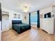 Bedroom featuring a ceiling fan, lots of light, and a dark-colored bed at 11335 Mcmullen Loop, Riverview, FL 33569