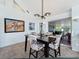 Dining area with a modern light fixture and view of the backyard at 11335 Mcmullen Loop, Riverview, FL 33569