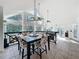 Dining room with cathedral ceilings, large windows, and seating for four at 11335 Mcmullen Loop, Riverview, FL 33569