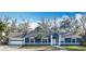 Charming single-story home with attached garage, basketball hoop, and well-manicured landscaping at 11335 Mcmullen Loop, Riverview, FL 33569