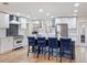 Modern kitchen with stainless steel appliances, a center island, and pendant lighting at 11335 Mcmullen Loop, Riverview, FL 33569