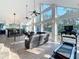 Bright living room with large windows, tile floors, and comfortable seating at 11335 Mcmullen Loop, Riverview, FL 33569