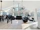 Living room with high vaulted ceilings, large windows and comfortable seating at 11335 Mcmullen Loop, Riverview, FL 33569