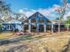 Home with a spacious backyard and a deck area for outdoor enjoyment at 11335 Mcmullen Loop, Riverview, FL 33569