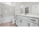 Bright bathroom with a bathtub, quartz countertops, tile floors, and neutral walls at 12652 Glenn Creek Dr, Riverview, FL 33569