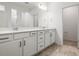 Modern bathroom featuring a double vanity with white cabinets and countertops at 12652 Glenn Creek Dr, Riverview, FL 33569