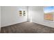 Bright bedroom featuring plush carpeting, windows, and ample natural light at 12652 Glenn Creek Dr, Riverview, FL 33569