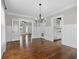 Formal dining room with hardwood floors and adjacent views of the Kitchen and Living spaces at 134 22Nd N Ave, St Petersburg, FL 33704