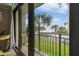 Beautiful balcony with views of the beach, palm trees, and community swimming pool at 1390 Gulf Blvd # 102, Clearwater, FL 33767