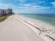 Expansive beachfront offering tranquil waters and soft sands steps away from condominiums at 1390 Gulf Blvd # 102, Clearwater, FL 33767