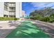 Inviting shuffleboard court with lush greenery in a well-maintained community space at 1390 Gulf Blvd # 102, Clearwater, FL 33767